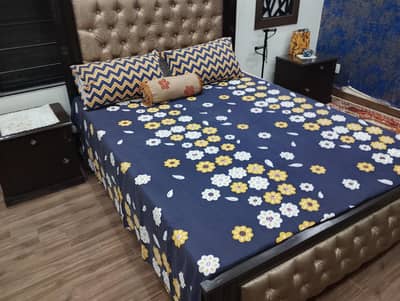 Queen size bed with two side tables