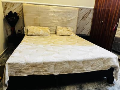 King size used bed with spring mattress.
