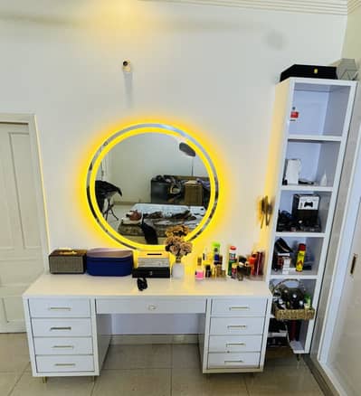White dressing table with a large round LED mirror