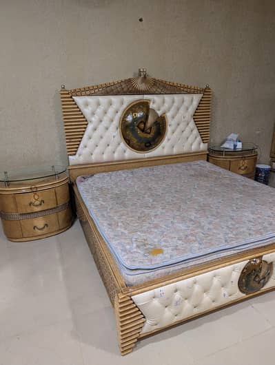 Bed set by Talent n Taste with dresser and Tv wall