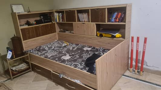 Wooden bed with shelves and drawers for sale